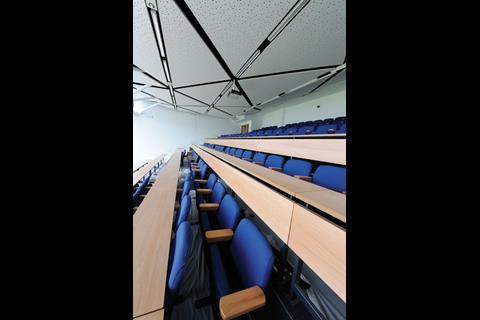 The auditorium can be converted from a 150-seat lecture theatre to a press room for 100 journalists in less than six hours. Internal suspended ceiling panels pick up the triangular theme of the external cladding
